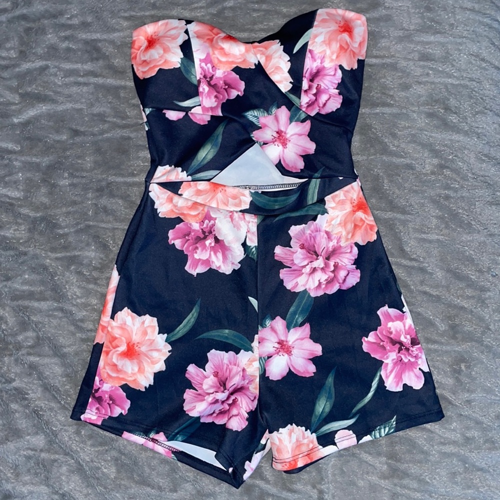 Floral FashionNova romper with cut out in the middle